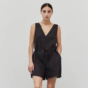 Grade and Gather V-neck romper with a tie waist and button back.